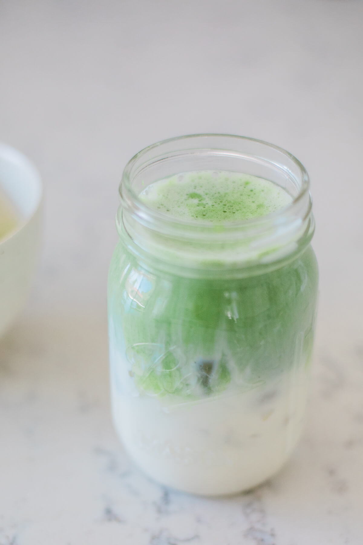 The best vegan matcha latte recipe full of superfoods + rich antioxidants! This beautifying drink will boost your energy while promoting health and beauty.